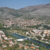 Picturesque aerial view of Trebinje, showcasing the old town, bridge, and surrounding mountains.