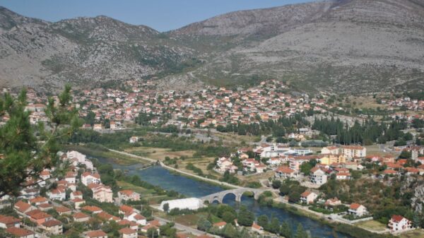 Picturesque aerial view of Trebinje, showcasing the old town, bridge, and surrounding mountains.