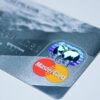 Detail shot of a MasterCard credit card, showing the chip and logo.