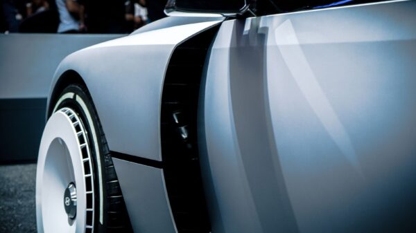 Sleek futuristic concept car showcased in Jakarta. Modern automotive design and innovation.