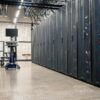 Steel framework cabinets housing servers networking devices and cables in contemporary equipped data center