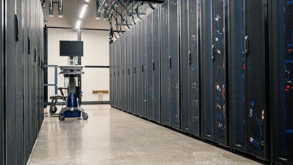 Steel framework cabinets housing servers networking devices and cables in contemporary equipped data center