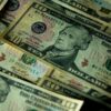 Detailed close-up of multiple US dollar bills highlighting financial themes.