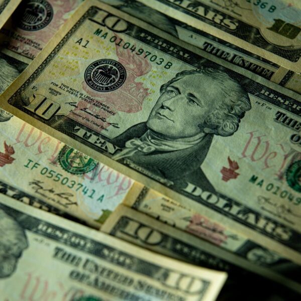 Detailed close-up of multiple US dollar bills highlighting financial themes.