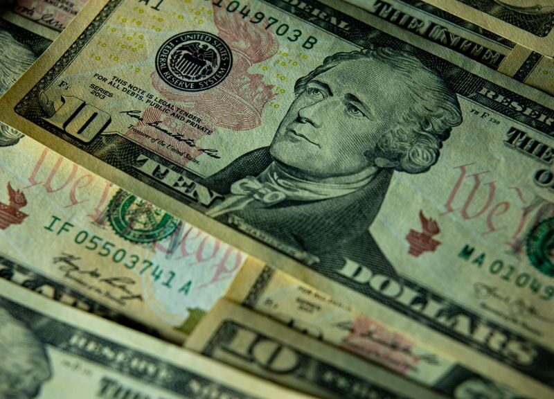 Detailed close-up of multiple US dollar bills highlighting financial themes.