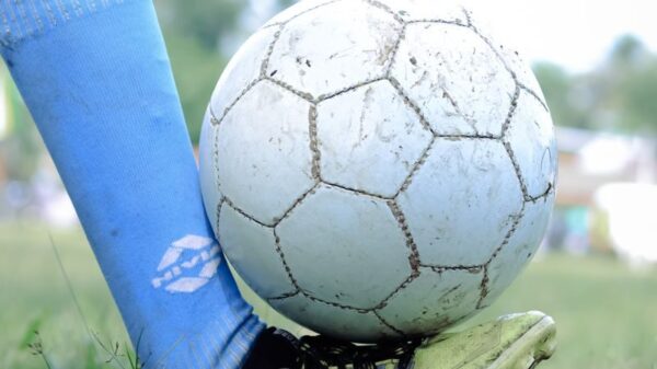 Close-up of a soccer player controlling the ball during a game in Kuttanad.
