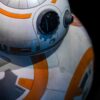 Detailed close-up of a spherical robot with orange and white design.