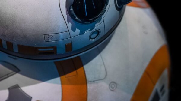 Detailed close-up of a spherical robot with orange and white design.