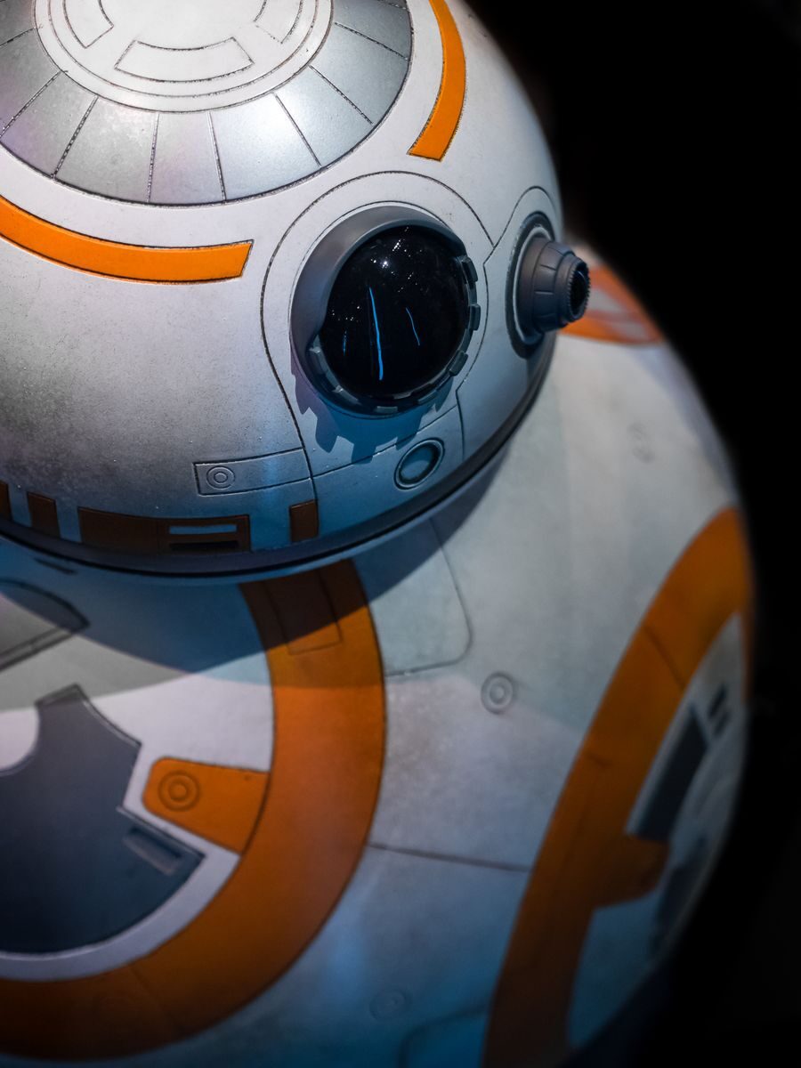 Detailed close-up of a spherical robot with orange and white design.