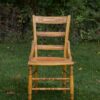 brown wooden chair on grass covered plain