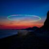 Stunning long-exposure view of sunset with light streaks over Beer Beach, England.