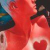 Vibrant mannequin torso with blue hair and heart design, perfect for artistic themes.