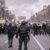 Demonstrators and police face off during a protest in Paris, near the Arc de Triomphe.