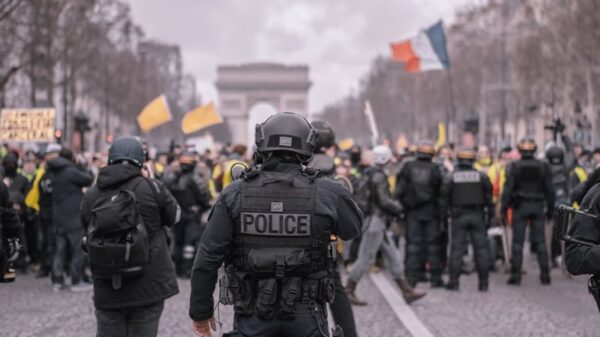Demonstrators and police face off during a protest in Paris, near the Arc de Triomphe.