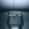 clear drinking glass on gray surface