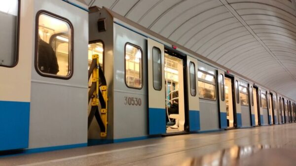 A sleek subway train at a modern urban metro station showcasing public transportation.