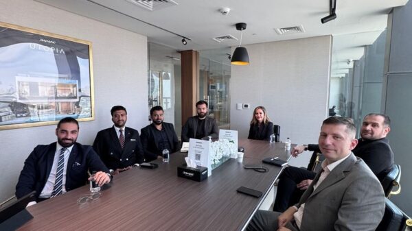 Business professionals in a formal meeting at a modern conference room.