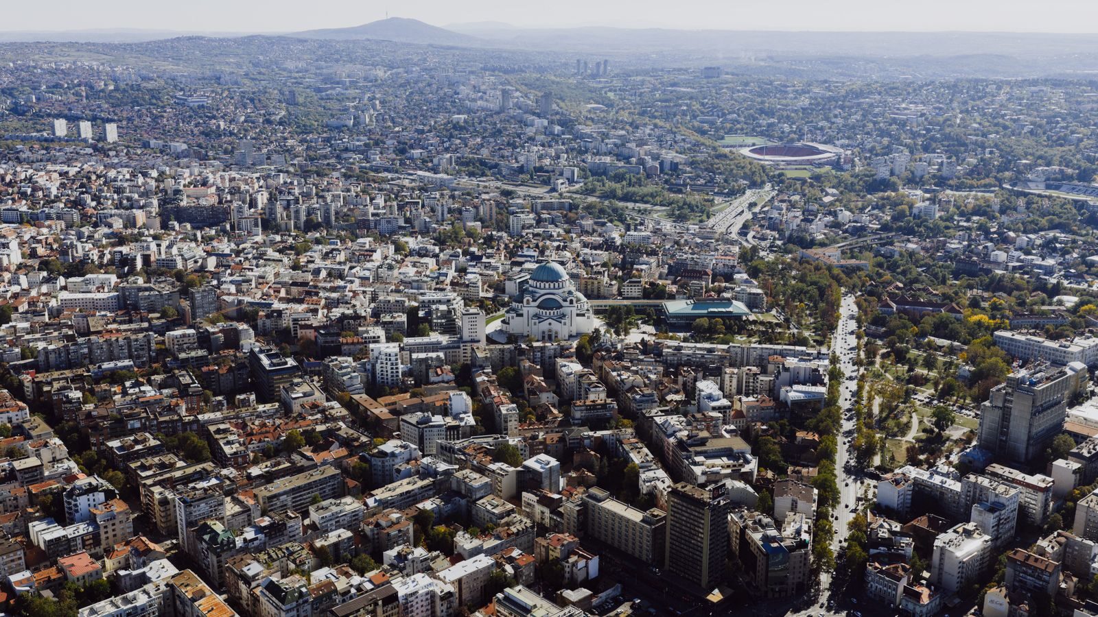 Aerial shot of Belgrade cityscape featuring the iconic St. Sava Temple, Serbia.