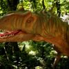 Detailed dinosaur model in a lush forest, showcasing realistic textures and vibrant colors.
