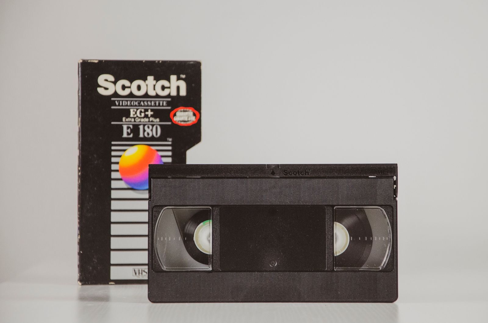 Retro VHS tape with original box, symbolizing 80s nostalgia and analog technology.