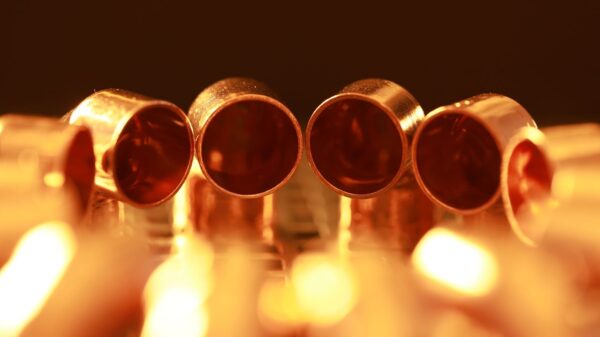 Macro shot of brass tubes with warm, glowing lighting, showcasing a serene and vintage ambiance.