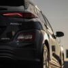 Vertical shot of a sleek Hyundai Kona electric car with stylish taillights.