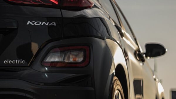 Vertical shot of a sleek Hyundai Kona electric car with stylish taillights.