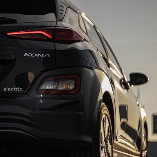 Vertical shot of a sleek Hyundai Kona electric car with stylish taillights.