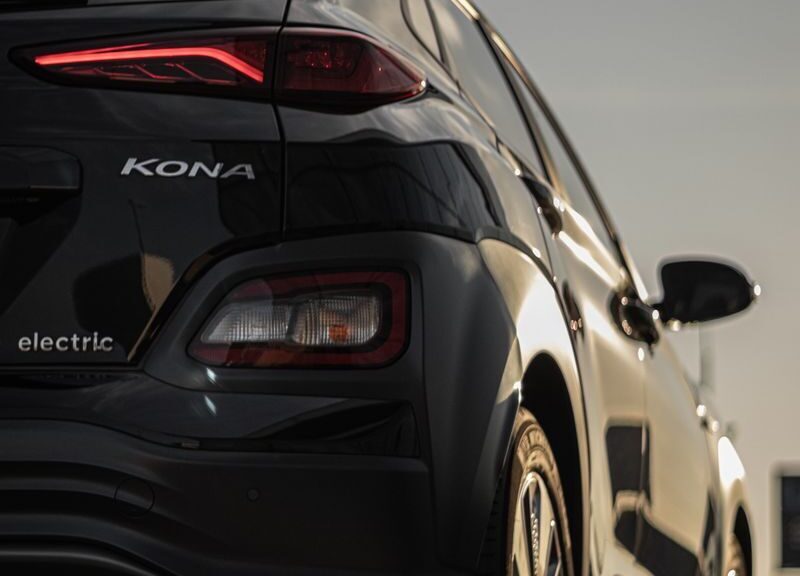 Vertical shot of a sleek Hyundai Kona electric car with stylish taillights.