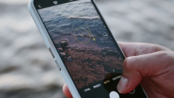 A smartphone capturing ocean waves, highlighting modern mobile photography.