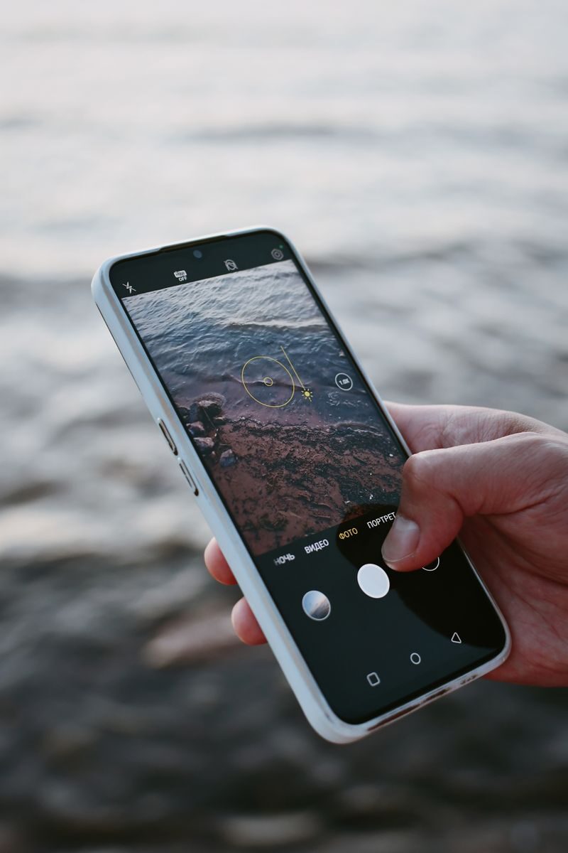 A smartphone capturing ocean waves, highlighting modern mobile photography.