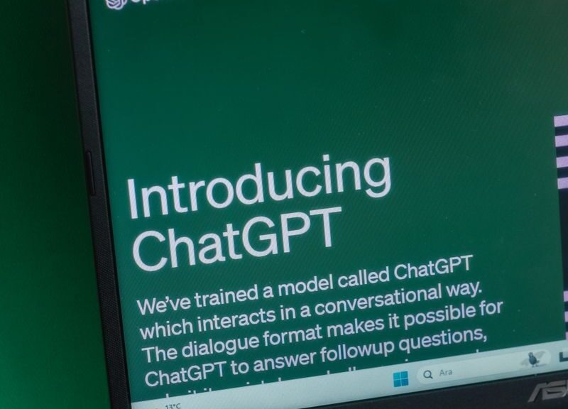 Laptop displaying ChatGPT introduction page on a web browser.