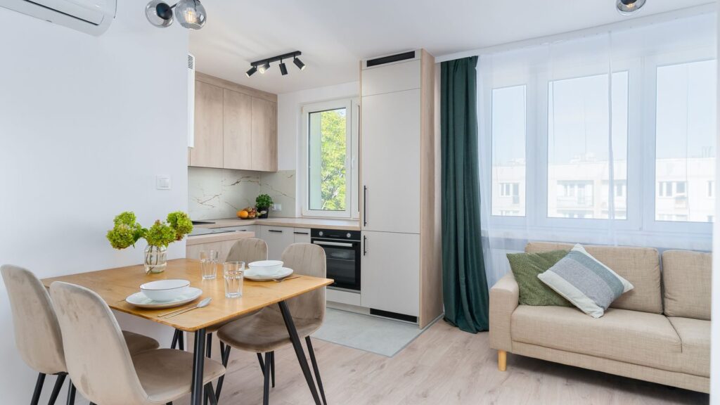 Bright kitchen with dining area in Scandinavian style, featuring minimalist design.