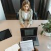 High-angle view of a job interview in a modern office setting, capturing professionalism.
