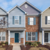 Elegant view of suburban townhouses showcasing diverse architectural styles.