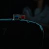 A dimly lit cinema featuring a pair of 3D glasses on a theater seat, capturing an immersive movie-going experience.