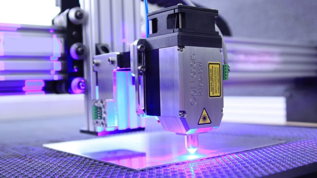 Detailed view of an industrial laser engraving machine in action, highlighting precision equipment.