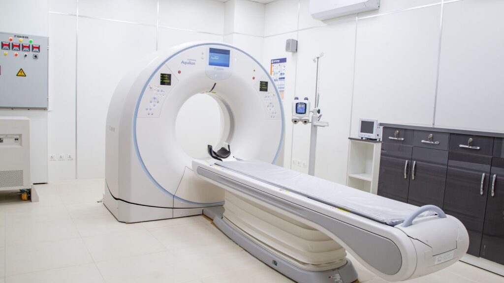 High-resolution image of a modern, clean MRI scanner room in a hospital facility.