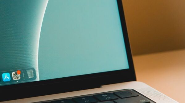 A sleek modern laptop with a close-up view of the screen and keyboard on a desk.