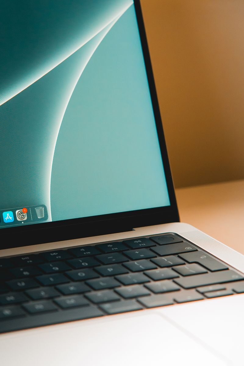 A sleek modern laptop with a close-up view of the screen and keyboard on a desk.