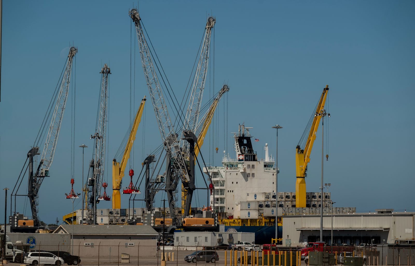 Container ship and cranes at Port Hueneme, California seaport, showcasing industrial operations.