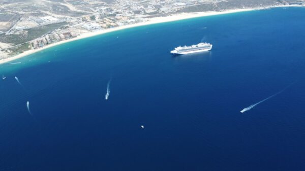 Stunning aerial view of a cruise ship sailing off the coast of Cabo San Lucas, Mexico.