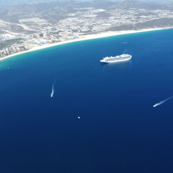 Stunning aerial view of a cruise ship sailing off the coast of Cabo San Lucas, Mexico.