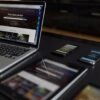A contemporary workspace showcasing a laptop, tablet, and smartphones, ideal for tech and freelance use.