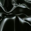 a black and white photo of a wavy surface