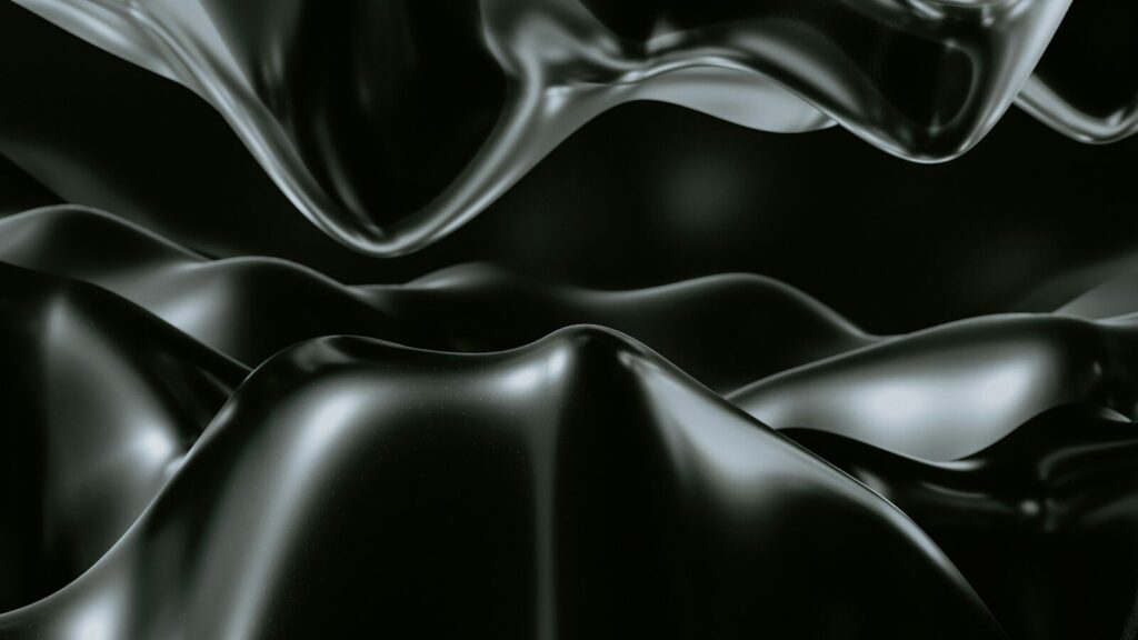 a black and white photo of a wavy surface