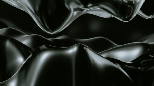 a black and white photo of a wavy surface