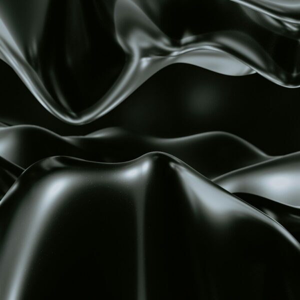 a black and white photo of a wavy surface